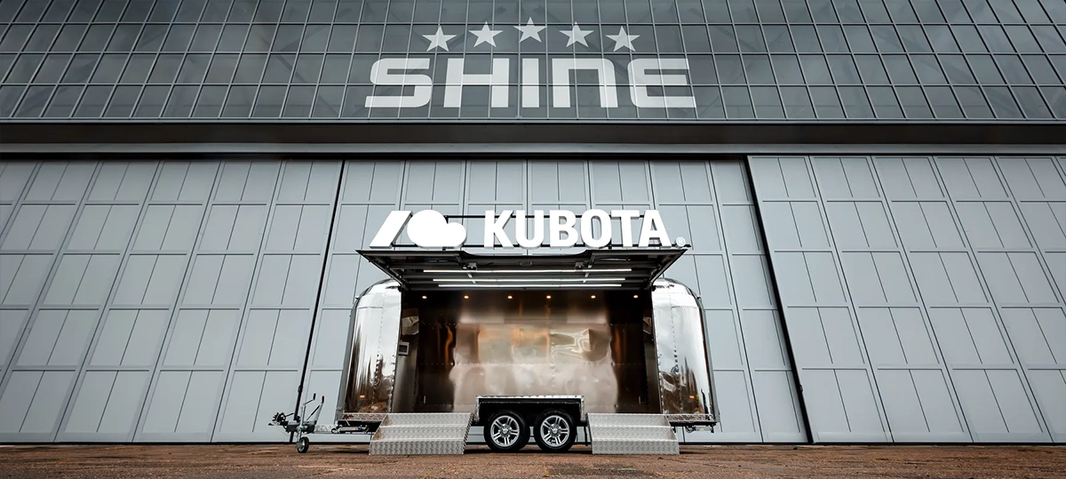 Event and Exhibition Trailer Rental 1 A gleaming SHINE Event Trailer against a modern building